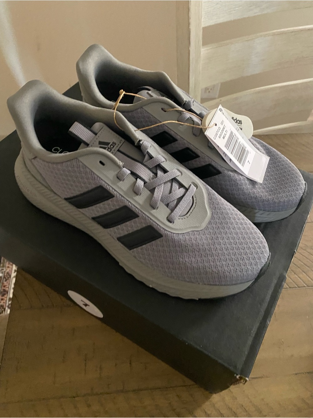 adidas women’s Gray Mesh Running Shoes with Black Stripes